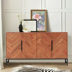 the sideboard is made out of wood and has an animal print rug