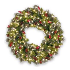 a christmas wreath with lights and pine cones