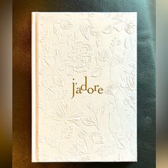 a white book with the word jadote written on it's front cover