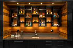 an empty bar with liquor bottles on the shelves