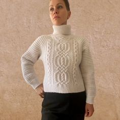 The cropped-hem sweater LUNA is a cosy and chic cold-weather wardrobe essential. Hand-knit from an extra-fine merino wool and alpaca blend, this super-soft style features a straight silhouette, raglan sleeves, and a classic cable-knit pattern. You can choose the preferred neckline: turtleneck or crewneck. Off white colour. You can choose any other colour listed in the last photo. Designed and ethically made in North Europe, EU. Sustainable |Biodegradable | Zero synthetics Materials: 50% extra-fi Elegant Merino Wool Cable Knit Sweater, White Wool Cable Knit Sweater, Wool Long Sleeve Cable Knit Tops, Merino Wool Cable Knit Long Sleeve Tops, Cable Knit Merino Wool Long Sleeve Turtleneck, Hem Sweater, Knit Alpaca, Pullover Sweater Women, Off White Color