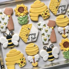 decorated cookies in the shape of bees and honeycombs