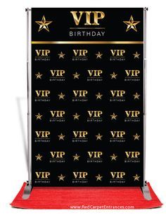 a black backdrop with gold stars and the words happy birthday written on it, along with a red carpet