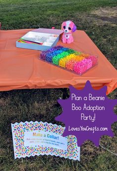 an orange table topped with lots of colorful confetti next to a sign that says plan a beanie boo addition party