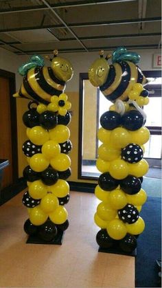 some balloons are in the shape of bees