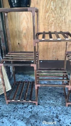 two wooden chairs sitting on top of a blue carpet