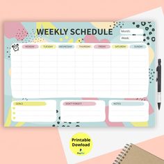 a printable weekly planner is shown on top of a desk with a notepad and pen