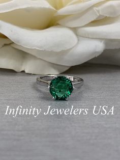 "The ring pictured is lab created emerald #5837 Also Shown in 14k White Gold -Approximate total carat weight: approx. 1.90ctw diamond equivalent -Center Stone Size: 8mm - approx. 1.90ct diamond equivalent -Center Stone Shape: round / rose cut -Gem Type: lab created emerald -Stone Clarity: VS2 -Stone Color: Green -Moh's Scale: 8x.5 hardness -Metal Type and Purity: 14k yellow gold -Setting: 6 prong crown head -Stock Ring Size: 6 -Country of Manufacturing: USA (Michigan) For customization please co Emerald Ring With Center Stone In 14k White Gold, Proposal Jewelry With May Birthstone In Round Cut, Round Cut May Birthstone Jewelry For Proposals, Classic May Birthstone Jewelry For Proposal, May Birthstone Jewelry For Proposal With Round Cut, Formal Diamond Ring With Prong-set Emeralds, Classic White Gold Emerald Ring For Proposal, Fine Jewelry Emerald Ring For Proposal, Timeless Emerald Anniversary Ring