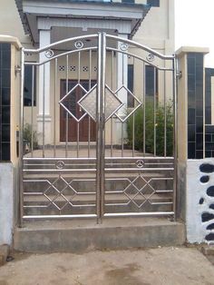 an iron gate in front of a building