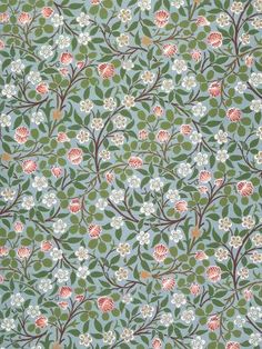 an old wallpaper with many flowers and leaves on it's sides, including one flowered tree