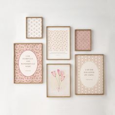 four framed pictures on the wall with pink flowers and polka dot designs in gold frames