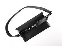 Shop our bum bags & fanny packs at SKINandSKIN store. This is the trendiest unisex handbag to be wearing right now. Made of premium quality black leather this men waist bag is an essential accessory for travel or everyday city life. Actually, it is not only a belt or hip bag but also a mini handbag which can be easily worn crossbody. On a date or a casual meeting, party or concert - the small purse is a must-have of the fall and summer fashion season. The elegant and attractive pouch bag als Casual Rectangular Belt Bag, Daily Use Belt Bag With Removable Belt, Black Crossbody Belt Bag For Daily Use, Daily Use Crossbody Belt Bag With Removable Belt, Black Pouch Belt Bag For Mobile Phone, Daily Crossbody Belt Bag With Removable Belt, Black Crossbody Mobile Phone Belt Bag, Modern Black Belt Bag With Mobile Phone Holder, Trendy Belt Bag With Removable Belt