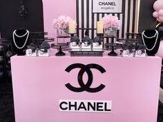 a chanel table with pink and black decorations