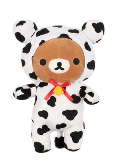 a brown and white stuffed animal with black spots