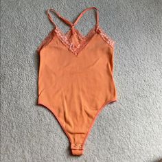 Orange Forever 21 Bodysuit Great Condition Never Worn Size Xs/Small Trendy Spring Bodysuit With Lined Body, Trendy Spring Bodysuit, Fitted Bodysuit For Spring Loungewear, Fitted Spring Bodysuit For Loungewear, Trendy Spring Bodysuit For Loungewear, Spring Bodysuit For Night Out With Lined Body, Trendy Spring Loungewear Bodysuit, Trendy Summer Bodysuit For Loungewear, Spring Casual Bodysuit With Lined Body