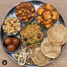 a metal plate topped with different types of food