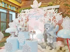 there are many snow decorations on display in the room