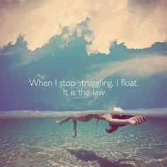 two people diving in the ocean with a quote above them that reads, when i stop struggling, i float, it is the law