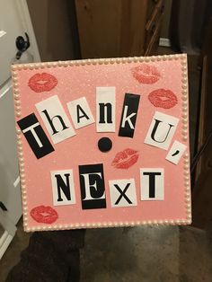 a person holding up a sign that says thank you next to lipstick and letters on it