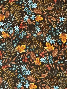 an image of a floral pattern with pine cones and blue flowers on black background for wallpaper