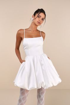 Moments made in the Lulus Exceptionally Sensational White Taffeta Bubble-Hem Mini Dress will be unforgettable and extra stylish! Luxe woven taffeta shapes this wow-worthy dress that features a sleeveless, princess-seamed bodice and a scoop neckline, supported by slender straps that flow into a lace-up design at back. The fitted waist tops a voluminous, skater-style mini skirt that finishes at a trendy bubble hem. Hidden back zipper/clasp. Fit: This garment fits true to size. Length: Mid-thigh. B Be Unforgettable, White Cocktail Dress, Bubble Hem, Formal Dresses Short, Date Night Dresses, Skater Style, White Mini Dress, Full Skirt, Skater Dress