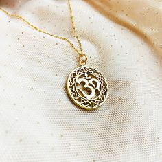 "This spiritual Sanskrit Ohm Mantra pendant is decorated with filigree ornament,   can give us many benefits for  our physical levels and emotional bodies . Gold Om necklace can be great Christmas gift , as Yoga jewelry, Buddhist jewel. ♡ DETAILS  ✦  Pendant: 20 mm ( 0.78\") ✦ All metal parts are sterling silver 924 gold plated 24 k  ✦ Necklace length please choose ♡ BUYING AS A GIFT? Each item is  perfectly wrapped for gift giving or as a wonderful present for you! All items come packaged in a Spiritual Medallion Necklace With Filigree, Spiritual Medallion Necklace With Filigree Details, Spiritual Filigree Medallion Necklace, Spiritual Medallion Filigree Necklace, Spiritual Round Pendant Necklace With Filigree, Symbolic Round Necklace With Intricate Design, Symbolic Necklaces With Intricate Design, Spiritual Round Filigree Necklace, Symbolic Intricate Design Jewelry For Festivals