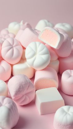 pink and white marshmallows on a pink background