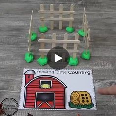 a video demonstrating how to make a farm scene with popsticks and plastic pegs