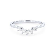 a three stone diamond ring in white gold with two diamonds on the top and bottom