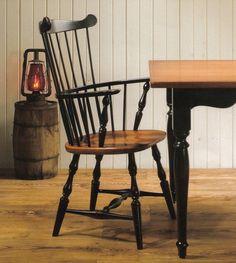 two chairs sitting next to each other on top of a wooden floor