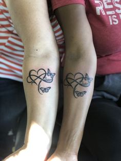 two people with matching tattoos on their arms