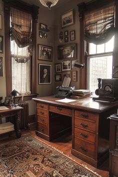 an old fashioned desk in the corner of a room with many pictures on the wall