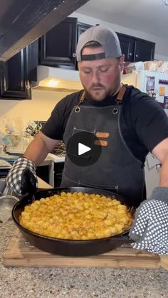 a man in an apron is making food