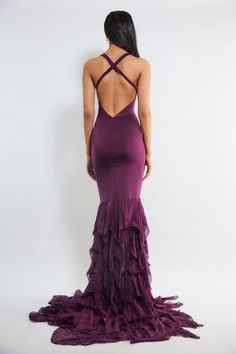 Wine halter neck gown with sheer panelled waistband and ruffle pleated border. - Aza Fashions Elegant Prom Maxi Dress With Ruffled Straps, Elegant Maxi Dress With Ruffled Straps For Prom, Fitted Maxi Dress With Ruffled Straps For Prom, Elegant Ruffled Straps Prom Evening Dress, Purple Evening Dress With Ruffled Fitted Bodice, Purple Sleeveless Ruffled Gown, Formal Fitted Maxi Dress With Ruffled Straps, Fitted Gown With Ruffled Skirt For Gala, Elegant Evening Gown With Ruffled Straps