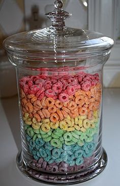 a jar filled with cereal sitting on top of a counter