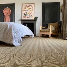 a bed sitting in a bedroom next to a fireplace