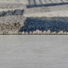 an area rug with blue and gray colors