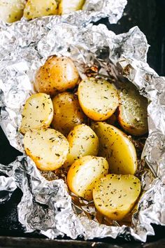 potatoes in foil with seasoning on top