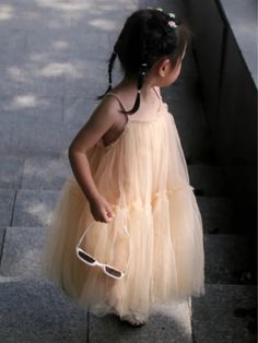 The dress of her dreams! Our layered tulle dress is almost as enchanted as your little princess, with a layering of tulle that will make her want to twirl all day. Time to show off her magic. Lightweight fabric keeps her comfortable all day. No itching, bunching, or stuffiness. Layered design gives her coverage for unlimited pirouettes! Perfect for spring, casual outings, fashion photoshoots, and year-round style adventures Layered tulle dress with adjustable straps Available in sizes 6MON-12MON; 2T-5Y for toddlers and little girls Summer Tutu Dress Made Of Tulle, Cute Summer Dresses For Dress-up Occasions, Cute Spring Tulle Skirt Dress, Elegant Sleeveless Dress For Summer Dress-up, Elegant Sleeveless Dress For Summer, Spring Sleeveless Tulle Tutu Dress, Sleeveless Dress-up Dresses For Spring, Cute Fitted Summer Tutu Dress, Chic Mini Length Dress-up Dresses