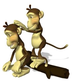 two monkeys sitting next to each other on top of a piece of wood