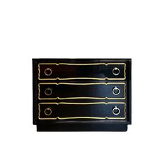 a black and gold chest of drawers with two rings on each drawer, against a white background