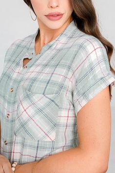 Plaid, but make it sunny! The Grace & Lace Short Sleeve Favorite Plaid is the warm weather version of your Favorite Button Up Plaid, perfect for embracing warmer days! Ultra soft and lightweight, this button up mint plaid top features the same stretchy fabric blend as the long sleeved version, for all-day comfort that flatters your shape. The mandarin collar, short sleeves and trendy soft color palette keeps this plaid fresh for any season. Style buttoned up or as a layer over tanks paired with your favorite light denim washes for an easy, everyday look! Casual plaid button-up top with short dolman sleeves. Fabric is woven with some stretch. Fit is true to size, stay in your normal size. If between sizes, size up for a more relaxed fit. * These are not an oversized design like the Favorite Summer Plaid Tops With Placket, Everyday Plaid Summer Tops, Plaid Tops With Button Closure For Daywear, Plaid Tops For Everyday Summer Wear, Casual Plaid Tops With Placket, Summer Plaid Tops With Buttons, Plaid Buttoned Tops For Summer, Plaid Tops With Button Closure For Summer, Spring Plaid Tops For Everyday