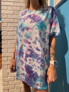 Size X-Large Blue and Purple Tie Dye Short Sleeve with Blue Reflective Saylor's Drip Shop Logo on the front.  Blue Reflective S.D.S on the back of the shirt! Pre- Washed, Recycled Worn Tie Dyed Shirt! Message me if you want something similar or a custom shirt! Bleached Blue Tops For Streetwear, Oversized Tie-dye T-shirt With Short Sleeves, Grunge Tie-dye Top, Blue Hand Dyed Short Sleeve T-shirt, Batik Shirt, Playful Tie Dye Short Sleeve T-shirt, Tie Dye T-shirt With Graffiti Print, Short Sleeve, Hand Dyed Tie-dye Short Sleeve T-shirt, Purple Tie