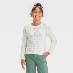 Add pretty patterns to your kid's cool-weather wardrobe with this Pullover Pointelle Sweater from Cat & Jack™. The pullover sweater is fashioned in a solid shade, elevated by the distinct pointelle medallions across the front. Crafted from a midweight recycled polyester blend, this relaxed-fit sweater features a crew neckline, long sleeves and a below-waist length, all trimmed with ribbed edges for added flair. Cat & Jack™: Designed for all children so you can trust it's made for yours. Pointelle Sweater, Pretty Patterns, Fitted Sweater, Cat & Jack, Waist Length, Girls Shopping, Pullover Sweater, Crew Neckline, Pullover Sweaters