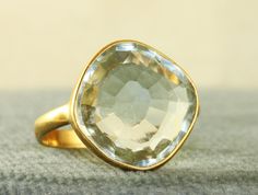 This is a great modernist artisan Ring.  It is Green Amethyst in a rich 14K surround.  It sports a 8+ CT pale Green Stone just right for Spring.  It weighs 4.4 grams in size 6.25.  In excellent estate condition. Modern Gold Amethyst Ring, Modern Gold Amethyst Gemstone Ring, Modern Yellow Gold Amethyst Ring Gift, Formal Gold Amethyst Ring With Green Stone, Formal Green Amethyst Ring In Gold, Gold Green Amethyst Ring For Formal Occasions, Formal Gold Green Amethyst Ring, Modern Gold Topaz Ring, Hallmarked, Modern Gold Oval Amethyst Ring