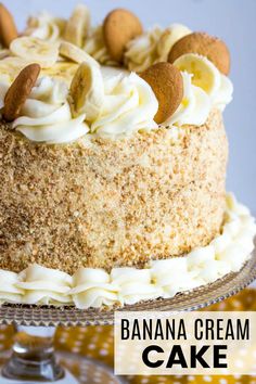 a cake with white frosting and nuts on top