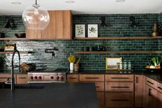 a kitchen with wooden cabinets and black counter tops