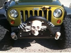 a jeep with skulls on it's front bumper