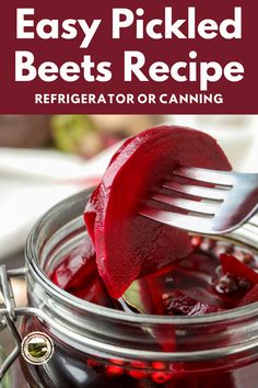 a jar filled with beets sitting on top of a table next to a fork