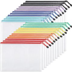 a bunch of different colored pencils lined up on top of each other in rows